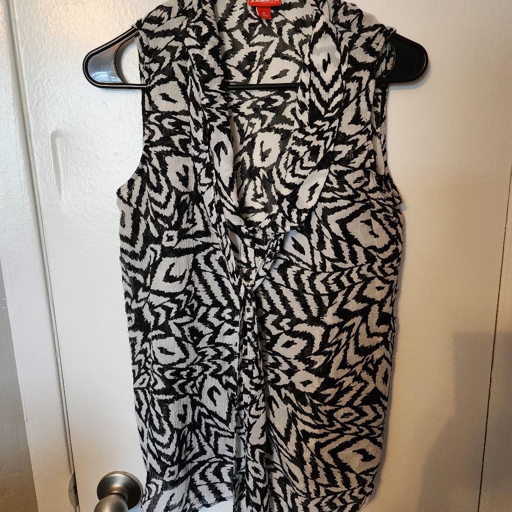 Black and white sleeveless blouse
